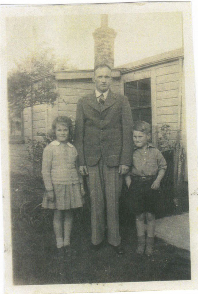 Barbara and Grant with Syd. Tom's place in the background. Approx 1946.