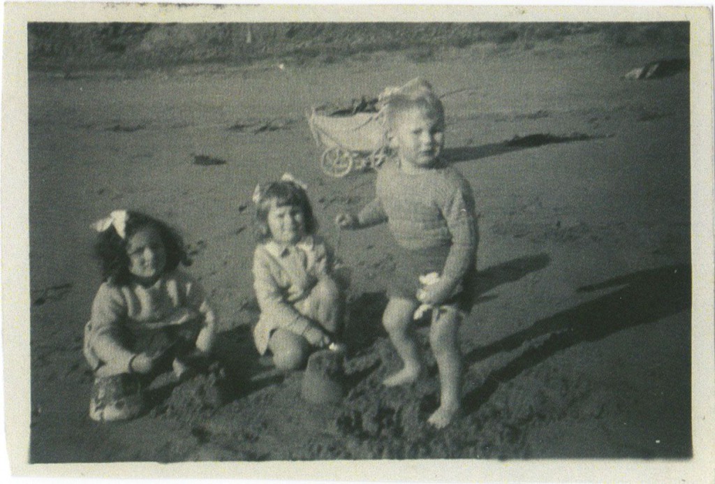 At summer beach building sand castles. Jeanette, Barbara and Grant.